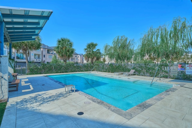 view of swimming pool featuring a patio area