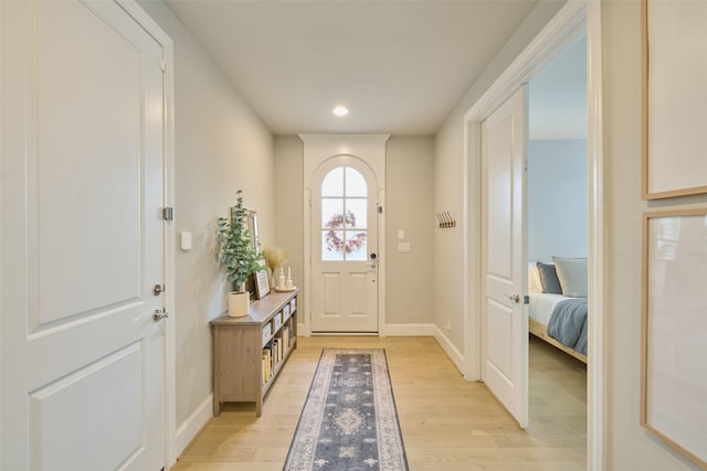 doorway with light wood-type flooring