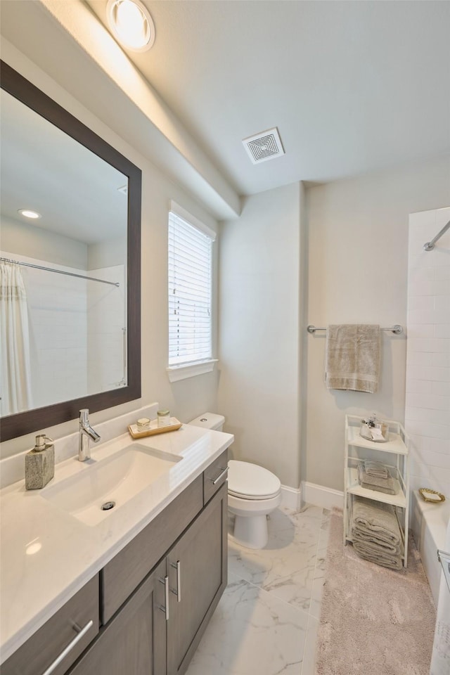 bathroom with vanity, a shower with curtain, and toilet