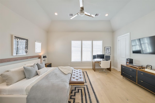 bedroom with ceiling fan, lofted ceiling, and light wood-type flooring