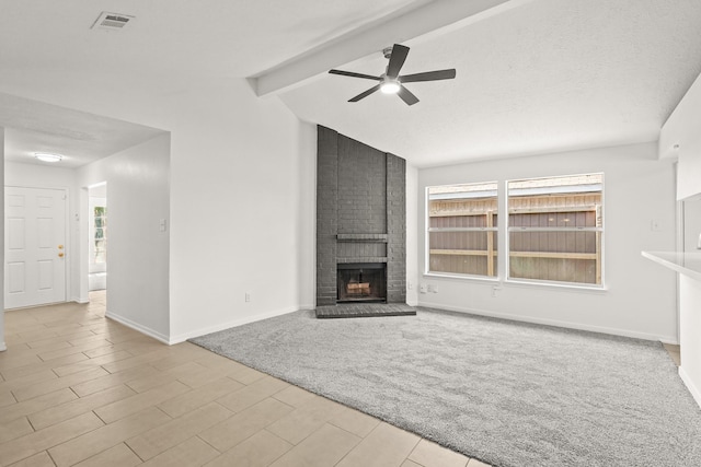 unfurnished living room featuring vaulted ceiling with beams, ceiling fan, light carpet, and a brick fireplace