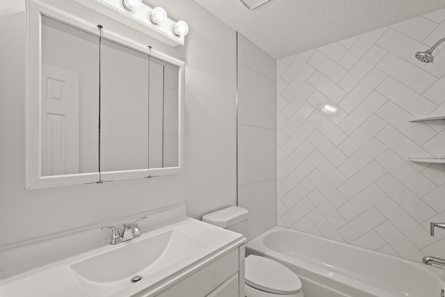 full bathroom with toilet, vanity, a textured ceiling, and tiled shower / bath