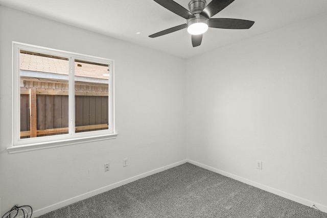 empty room with carpet flooring and ceiling fan