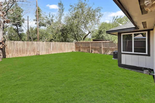 view of yard with central AC