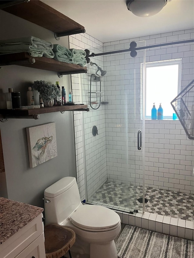 full bathroom with toilet and a stall shower