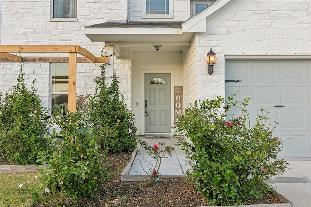 entrance to property featuring a garage