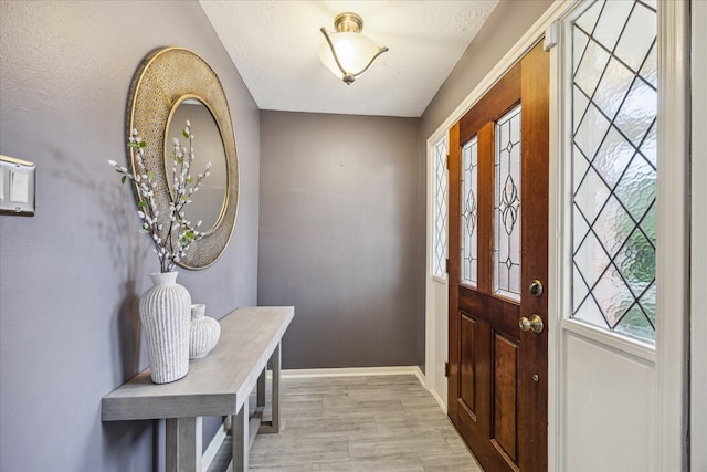 entryway with light hardwood / wood-style floors