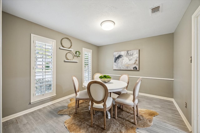 dining room with light wood-type flooring