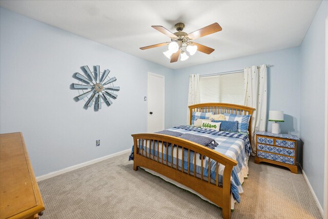 bedroom featuring ceiling fan and light carpet