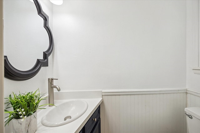 bathroom with toilet and vanity