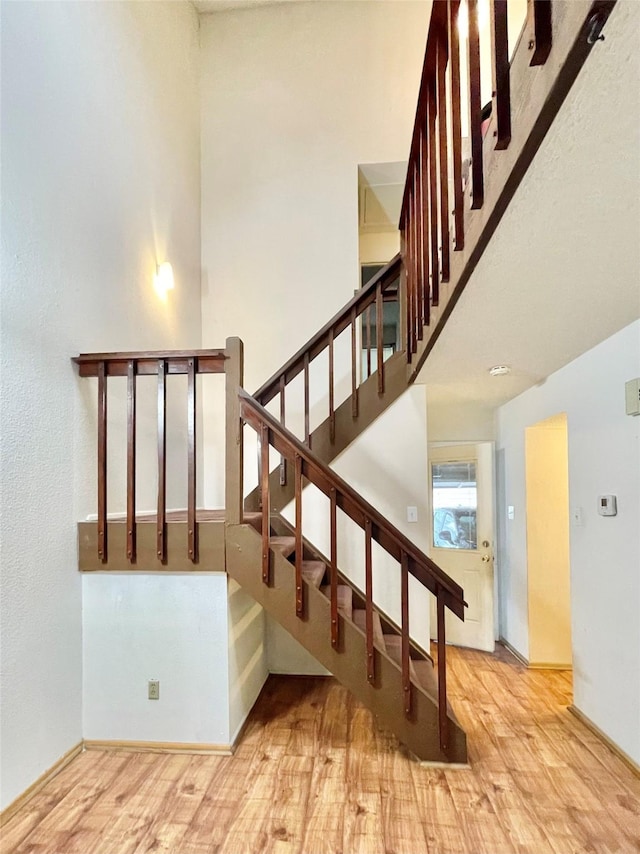 stairs with wood-type flooring