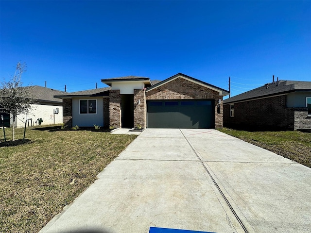 view of front facade featuring a front yard and a garage