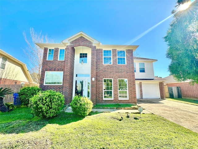 view of front of house featuring a garage and a front lawn