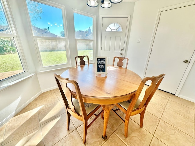 dining area featuring light tile patterned floors