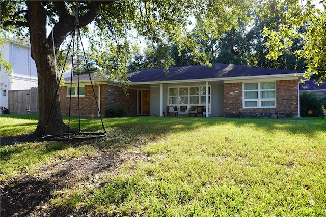 ranch-style house featuring a front yard