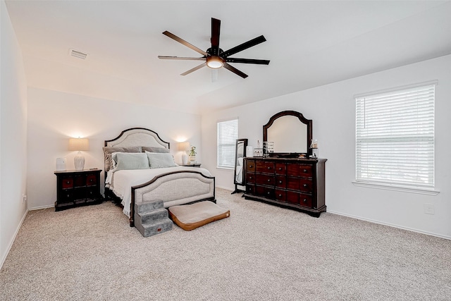 bedroom with ceiling fan and light carpet