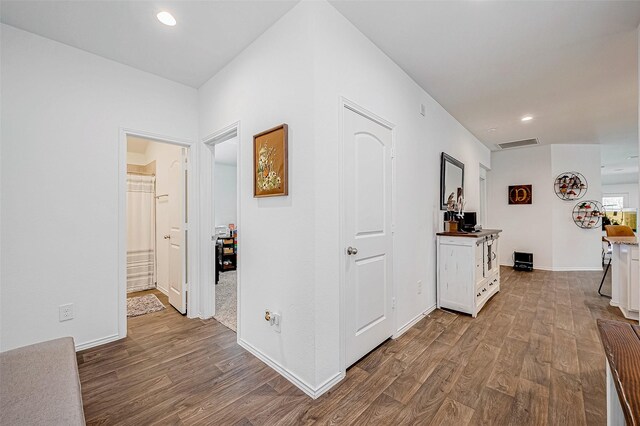 hallway featuring hardwood / wood-style flooring