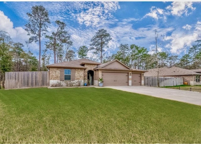 single story home with a garage and a front lawn