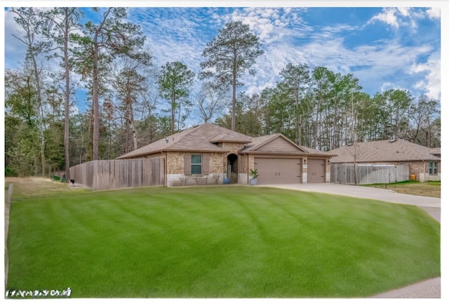 ranch-style home with a front yard and a garage