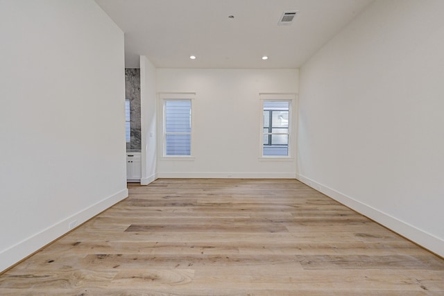 empty room with light hardwood / wood-style floors