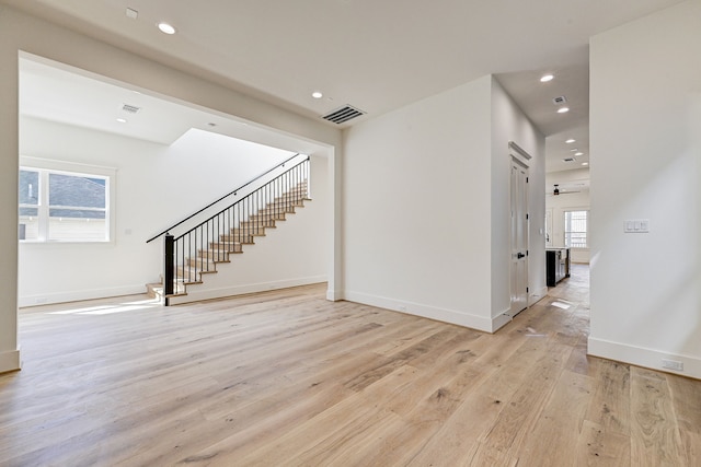 interior space featuring light hardwood / wood-style floors and ceiling fan