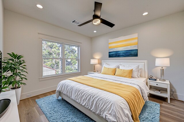 bedroom featuring light hardwood / wood-style floors and ceiling fan