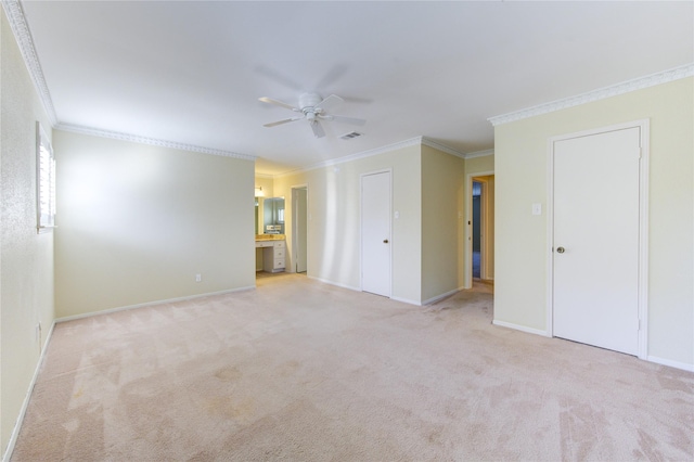 carpeted empty room with ornamental molding and ceiling fan