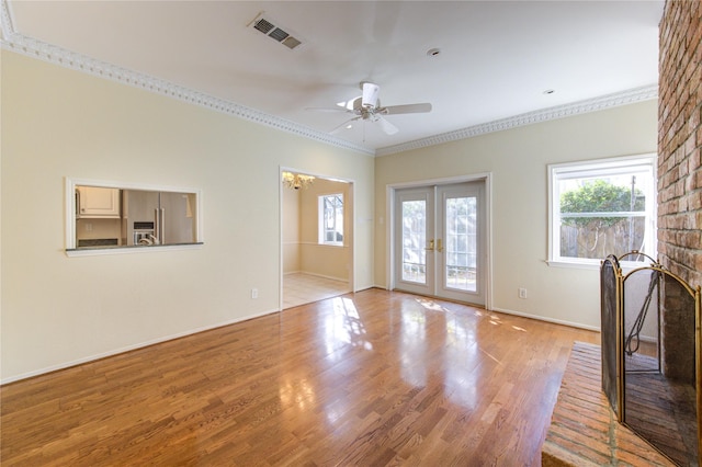 interior space with french doors, ceiling fan, crown molding, and light hardwood / wood-style flooring