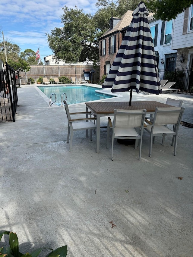 view of swimming pool featuring a patio area