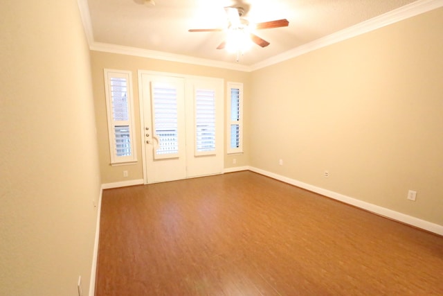 empty room with ceiling fan, wood-type flooring, and ornamental molding