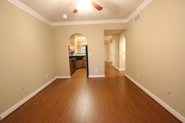 spare room featuring ceiling fan, dark hardwood / wood-style flooring, and ornamental molding