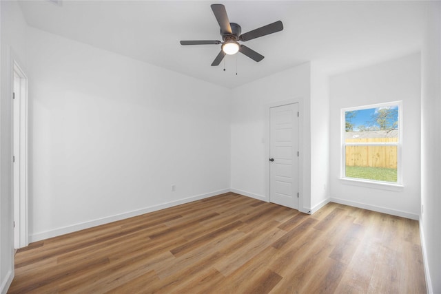 interior space with hardwood / wood-style floors, a closet, and ceiling fan