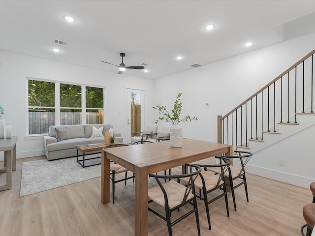 dining area featuring light wood-type flooring and ceiling fan