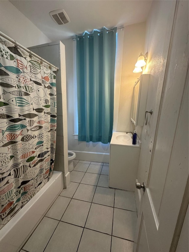 full bathroom with tile patterned floors, vanity, toilet, and shower / tub combo