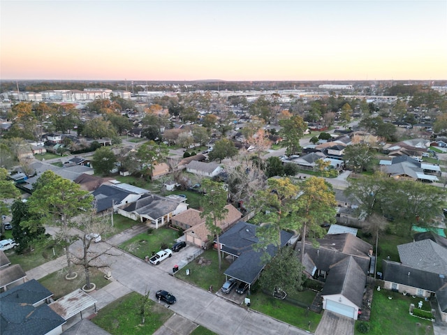 aerial view at dusk with a residential view