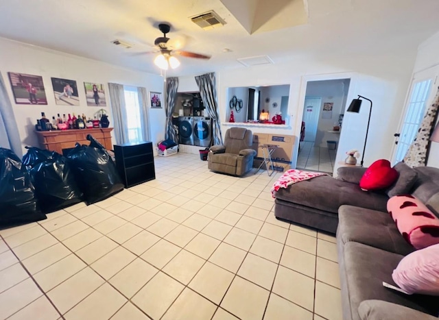 tiled living room featuring ceiling fan