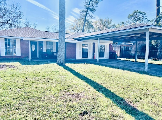 rear view of property with a lawn