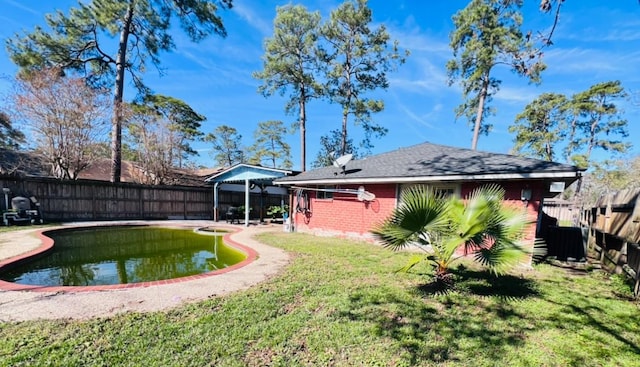 rear view of house with a lawn and central AC