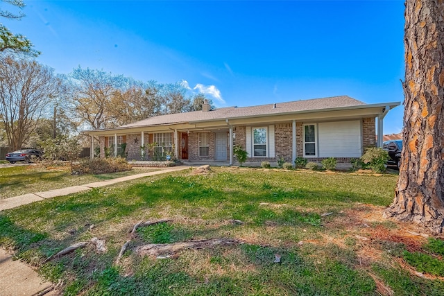 single story home with a front lawn, brick siding, and a chimney