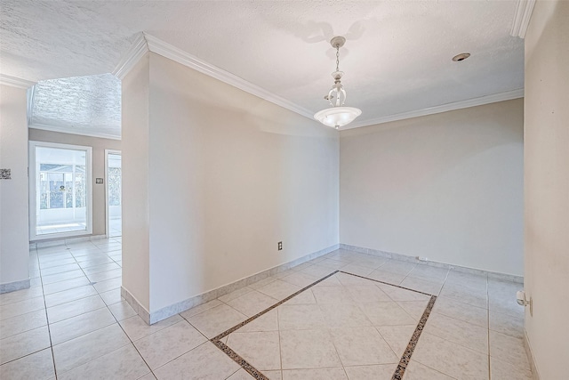 tiled empty room with a textured ceiling and ornamental molding