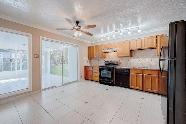 kitchen featuring light tile patterned floors, decorative backsplash, crown molding, and black appliances