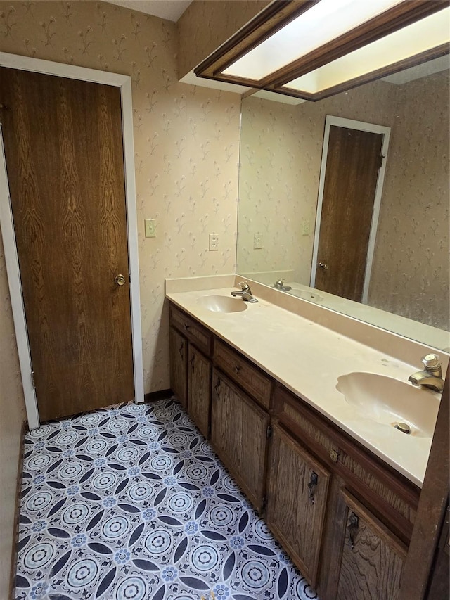 bathroom with tile patterned flooring and vanity