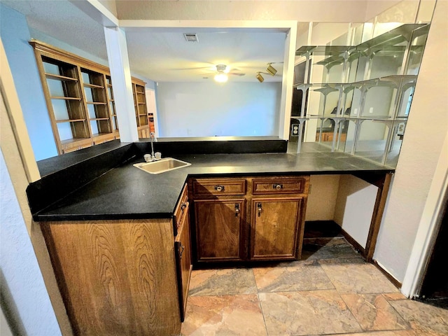 kitchen with ceiling fan and sink