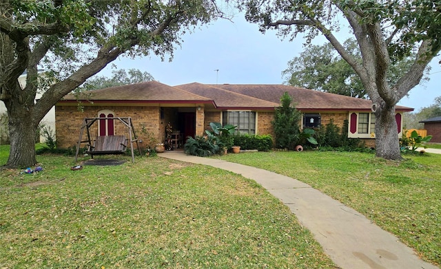 single story home featuring a front yard