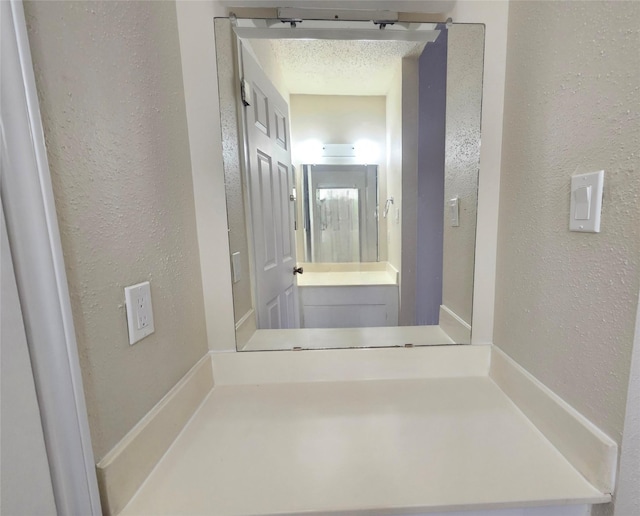 bathroom with a textured ceiling