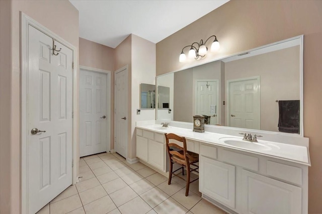 bathroom featuring tile patterned flooring and vanity