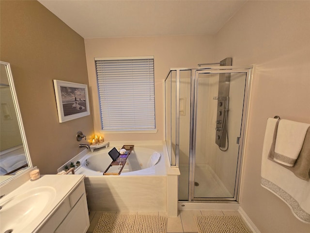 bathroom with tile patterned floors, vanity, and separate shower and tub