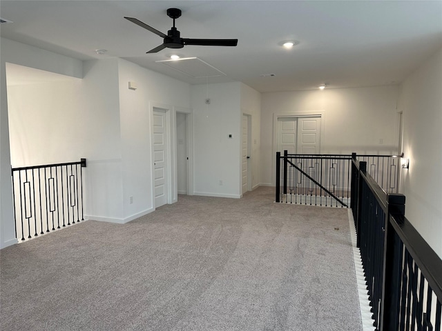 empty room featuring carpet flooring and ceiling fan