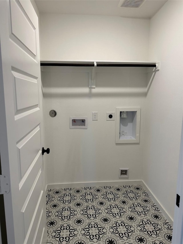 laundry room with electric dryer hookup, gas dryer hookup, light tile patterned floors, and washer hookup