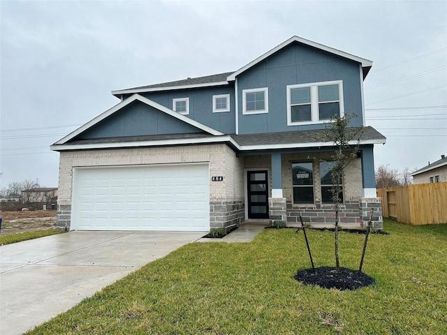 view of front of house featuring a garage and a front lawn